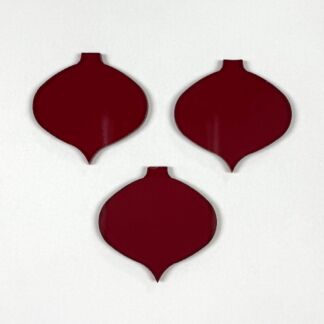Three burgundy onion-shaped ornaments arranged on a white background.